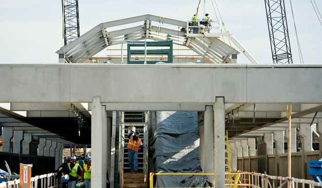 The Wiehle Avenue station being built between the Dulles Toll Road and Dulles Access Road will bring Metrorail service to Reston in Fairfax County. Whether the Silver Line expands into Loudoun County is up to the Board of Supervisors, which votes Tuesday on funding. (The Washington Times)