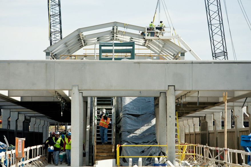 The Wiehle Avenue station being built between the Dulles Toll Road and Dulles Access Road will bring Metrorail service to Reston in Fairfax County. Whether the Silver Line expands into Loudoun County is up to the Board of Supervisors, which votes Tuesday on funding. (The Washington Times)