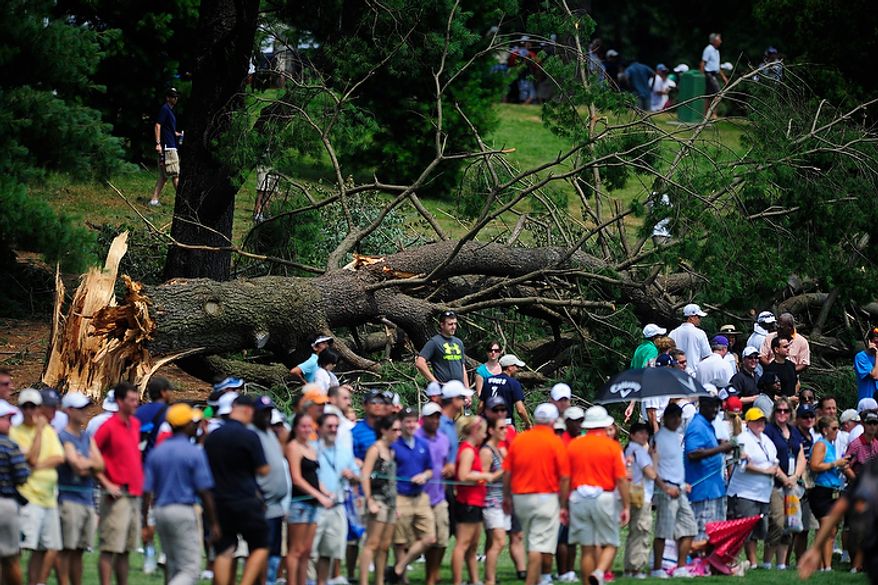 A downed tree remains just off the fifth fairway at Congressional Country Club during final round play of the AT&T National golf tournament, Bethesda, Md., Sunday, July 1, 2012. The tournament was closed to the public on Saturday during third round play due to damage from a storm Friday night. (Ryan M.L. Young/The Washington Times)