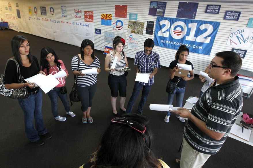 Brian Conklin (far right), a regional campaign director for the re-election of President Obama, briefs volunteers about registering new voters prior to them canvassing a heavily Latino neighborhood in Phoenix. Across the country both political parties have been courting the Latino vote, the nation's fastest-growing minority group. (AP Photo/Ross D. Franklin)