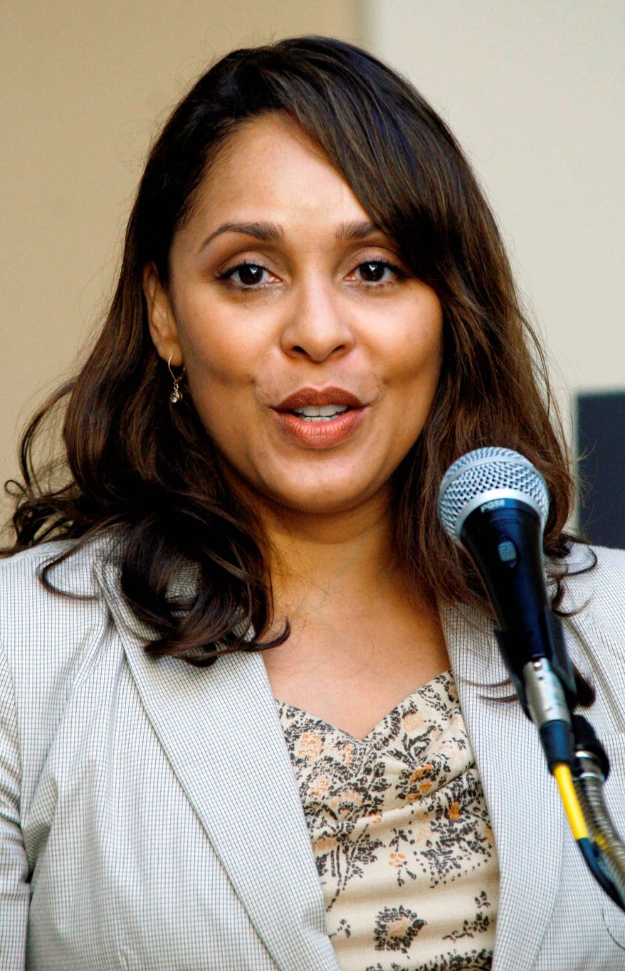 FILE - This Oct. 10, 2007 file photo shows Pulitzer Prize winning author Natasha Trethewey recites a poem at Delta State University in Cleveland, Miss. Trethewey, the nation's new poet laureate, is working on a memoir, currently untitled, that has been acquired by Ecco. The publisher, an imprint of HarperCollins, announced Monday, July 2, 2012, that the book is scheduled to come out in 2014. (AP Photo/Rogelio V. Solis, file)
