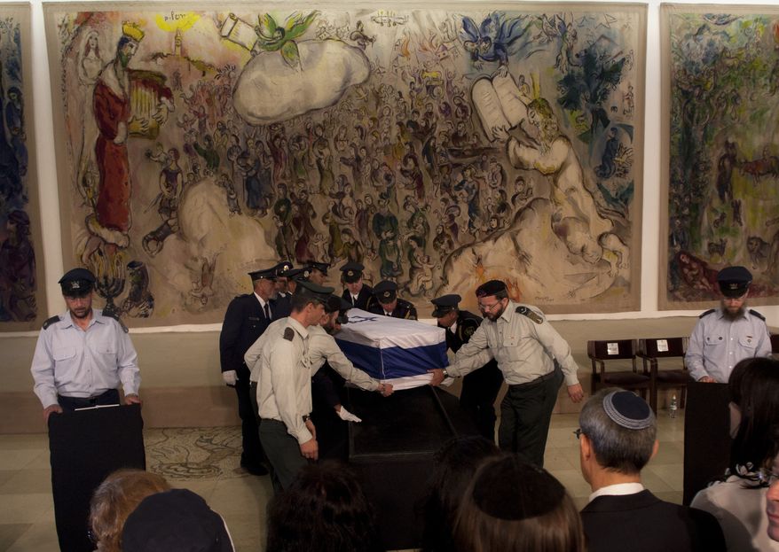 Israeli Knesset guard members carry the coffin of former Prime Minister Yitzhak Shamir during a ceremony at Israel's parliament in Jerusalem on Monday, July 2, 2012. The 96-year-old Mr. Shamir died Saturday. (AP Photo/Sebastian Scheiner)