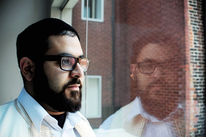 "This time last year, we really didn't think that we would get this far. So just getting to this point is amazing and historic," said Adam Sbita, a Libyan-American who voted at an Arlington County hotel in Libya's first multiparty national elections in more than four decades. (Ryan M.L. Young/The Washington Times)