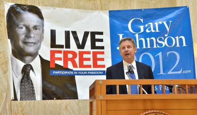 **FILE** Former New Mexico Gov. Gary Johnson announces his bid for the Libertarian Party presidential nomination on Dec. 28, 2011, in the rotunda of the New Mexico State Capitol in Santa Fe, N.M. (Associated Press/The New Mexican)