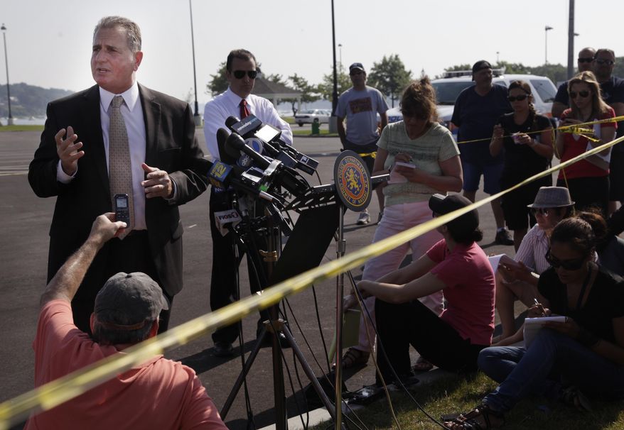 Detective Lt. John Azzata (left) of the Nassau County Police Department gives information about a fatal boating accident during a news conference in Oyster Bay, N.Y., on Thursday, July 5, 2012. (AP Photo/Seth Wenig)