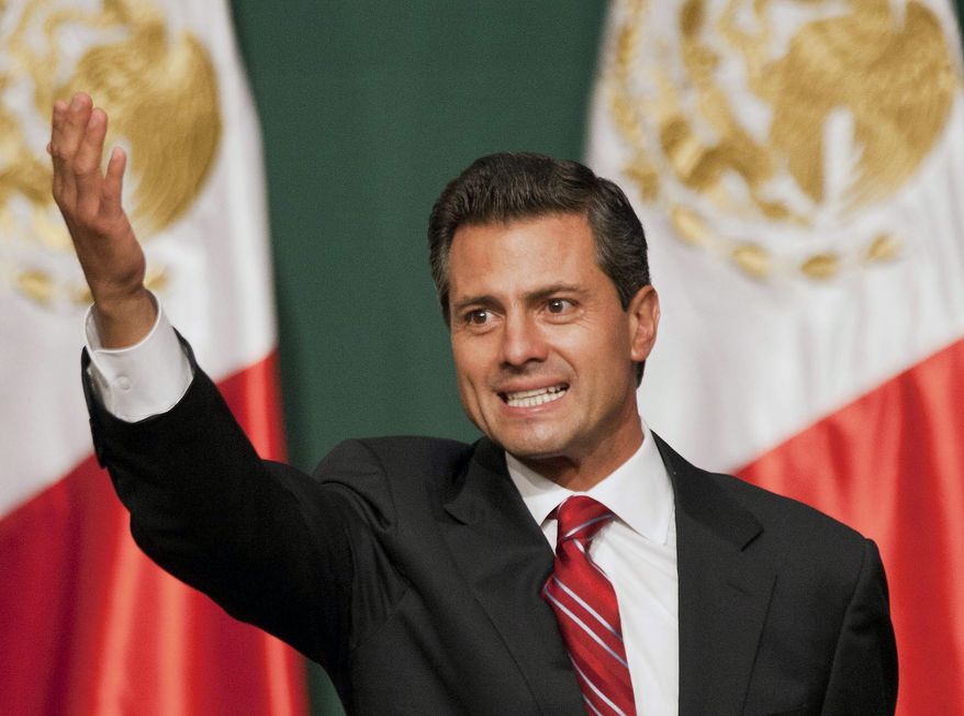 ** FILE ** Presidential candidate Enrique Pena Nieto waves to supporters at his party's headquarters in Mexico City early on Monday, July 2, 2012. Mexico's old guard sailed back into power after a 12-year hiatus Sunday as the official preliminary vote count handed a victory to Mr. Pena Nieto, whose party long was accused of ruling the country through corruption and patronage. (AP Photo/Christian Palma)