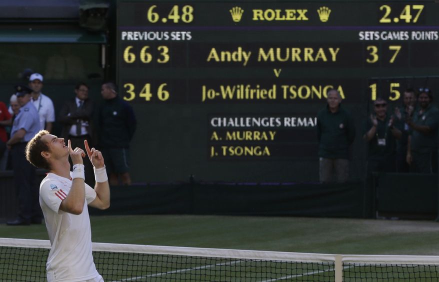 Andy Murray reacts after defeating Jo-Wilfried Tsonga in their semifinal match at the All England Lawn Tennis Championships at Wimbledon, England, Friday, July 6, 2012. Murray will play Roger Federer in the final. (AP Photo/Alastair Grant)