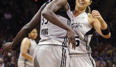 San Antonio Silver Stars&#39; Sophia Young, left, and Becky Hammon celebrate after Young scored against the Minnesota Lynx during their WNBA basketball game in San Antonio, Sunday, July 1, 2012. (AP Photo/The San Antonio Express-News, Edward A. Ornelas)  RUMBO DE SAN ANTONIO OUT; NO SALES; MANDATORY CREDIT; MAGS OUT