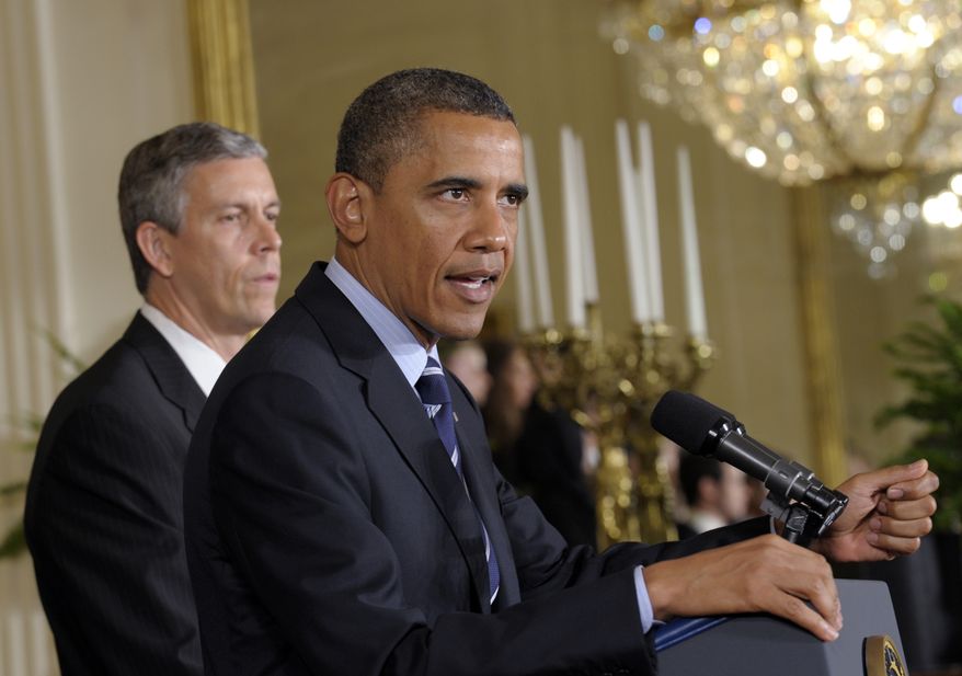 President Obama (right), with Education Secretary Arne Duncan at his side, calls on Congress during a June 21, 2012, news conference at the White House to stop interest rates on student loans from doubling. (Associated Press) ** FILE **