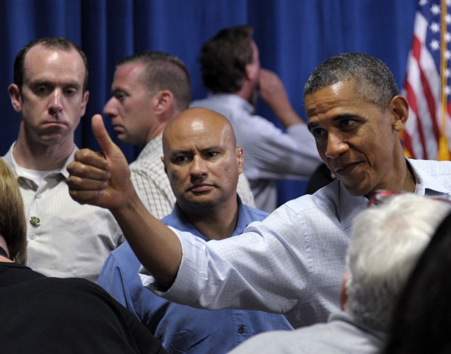 President Obama greets the crowd after speaking at Dobbins Elementary School in Poland, Ohio, on July 6, 2012, during a two-day bus trip through Ohio and Pennsylvania. (Associated Press)