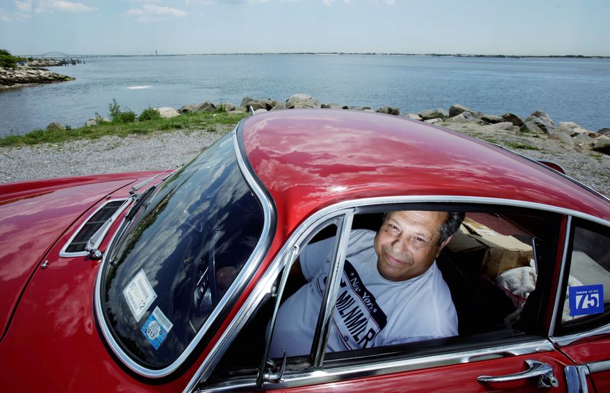 Irv Gordon, from Long Island, N.Y., is only about 34,000 miles short of hitting the 3,000,000-mile mark behind the wheel of his Volvo P1800S. "It's just a car I enjoy driving," he explained. (Associated Press)