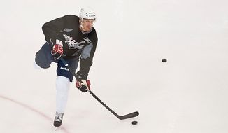 Cameron Schilling takes a shot during the Washington Capitals&#39; development camp at the Kettler Capitals Iceplex in Arlington on Monday, July 9, 2012. (Ryan M.L. Young/The Washington Times)