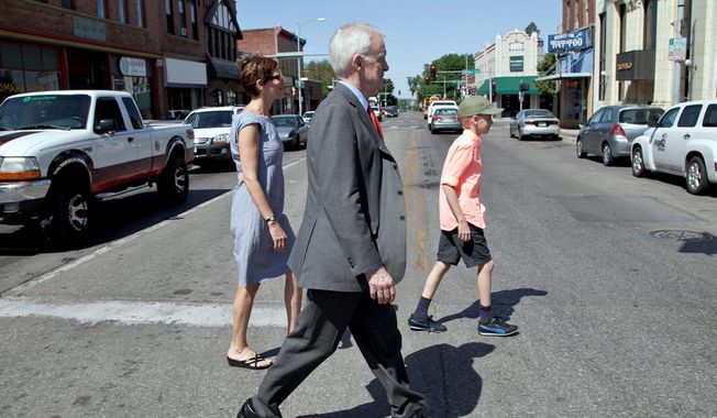 Bob Kerrey, a Democratic candidate for a Senate seat in Nebraska, tours the Benson neighborhood in Omaha with his wife, former Saturday Night Live writer Sarah Paley, and Henry, his son. Mr. Kerrey has described Ms. Paley as a &quot;comedian.&quot; (Associated Press)