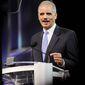 Attorney General Eric H. Holder Jr. speaks at the NAACP convention in Houston on Tuesday. Mr. Holder says a new photo-ID requirement in Texas elections would be harmful to minority voters. (Associated Press)