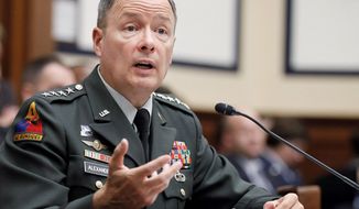 Army Gen. Keith B. Alexander, chief of U.S. Cyber Command, this week told a Chinese reporter that he thinks &quot;defending our country in cyberspace is one of our most important missions ...  to ensure that we&#39;re secure.&quot; (Associated Press)