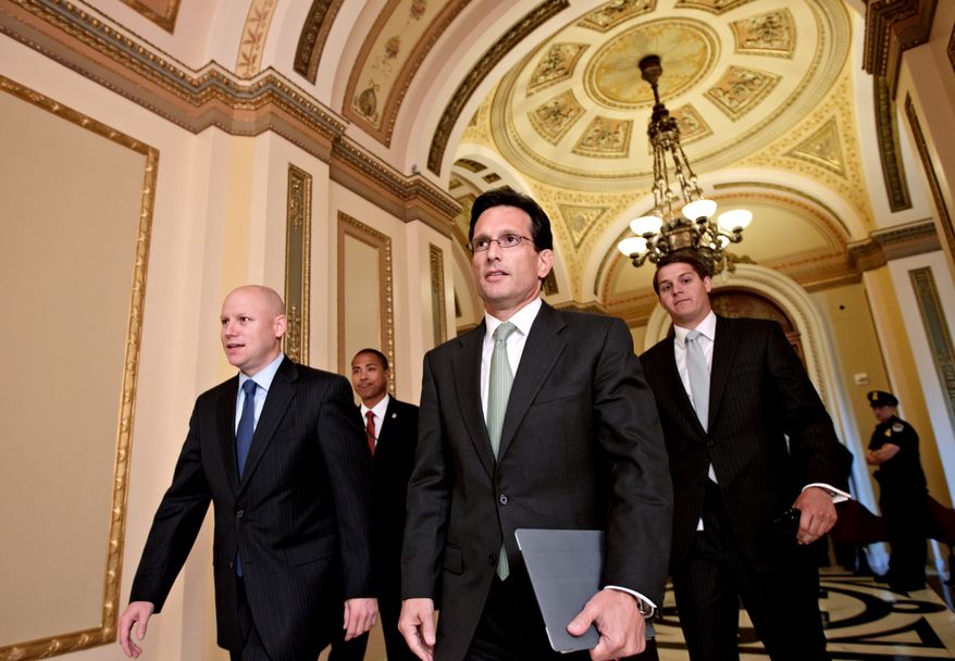 House Majority Leader Eric Cantor (center), Virginia Republican, walks July 11, 2012, from the House floor on Capitol Hill as he manages the vote to repeal the Affordable Care Act. (Associated Press)