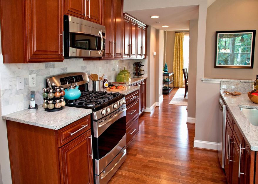 The Drum Point model's kitchen features 42-inch cabinets, granite counters, a pantry and recessed lighting. The kitchen connects to the dining room.