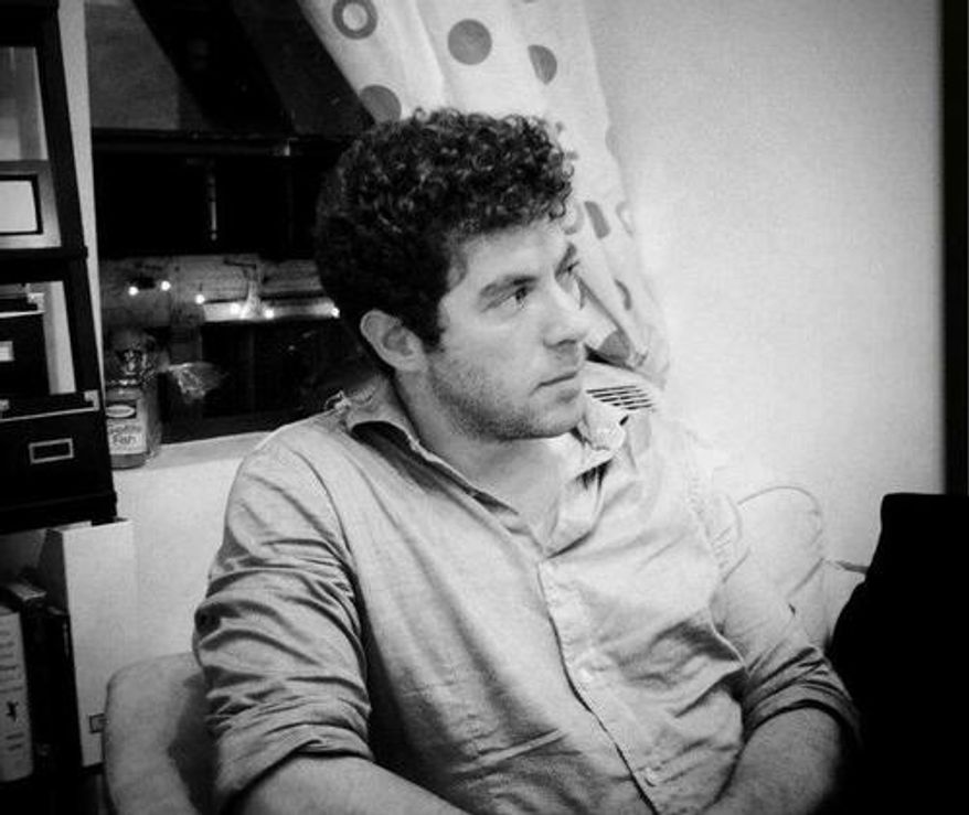 Alex Okrent, 29, who worked in Obama for America's paid media department, collapsed at the campaign office in the Prudential Building in downtown Chicago. (Via Twitter)