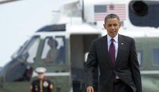 President Obama heads from Marine One to Air Force One at Andrews Air Force Base in Maryland on July 16, 2012. (Associated Press)