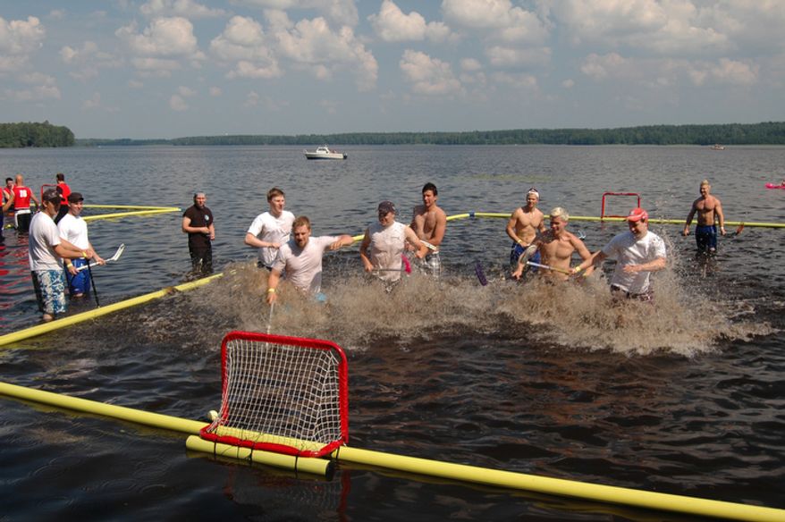 The open water floorball world championships are played in naural waters with a floating ball. The tournament takes place in Tammela, Finland. (Pekka Mertanen &amp; Ville Lahde/Special to The Washington Times)