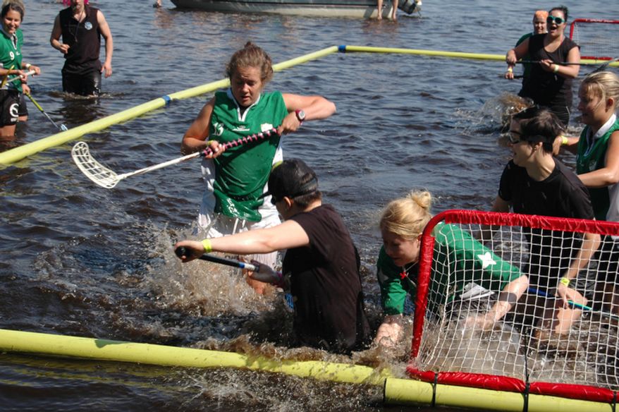 The open water floorball world championships are played in naural waters with a floating ball. The tournament takes place in Tammela, Finland. (Pekka Mertanen &amp; Ville Lahde/Special to The Washington Times)