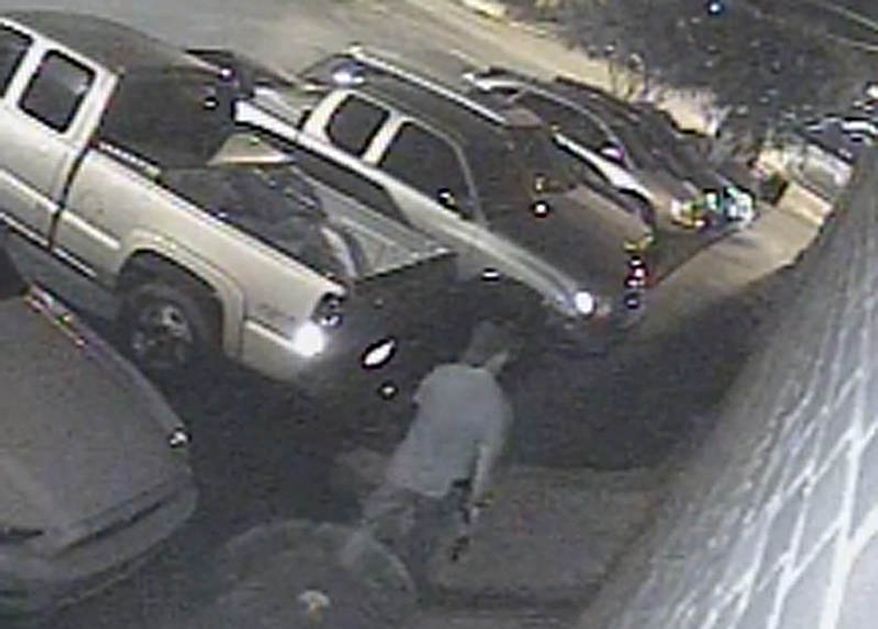 A suspected gunman walks near a Tuscaloosa, Ala., bar on Tuesday, July 17, 2012, in an image from surveillance video. Police say 17 people were wounded when a gunman opened fire outside a crowded bar. (AP Photo/Tuscaloosa Police Department)