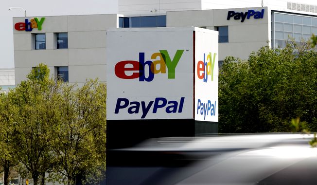 ** FILE ** In this Thursday, March 29, 2012, file photo, a vehicle drives in front of the PayPal/eBay offices in San Jose, Calif. (AP Photo/Paul Sakuma, File)