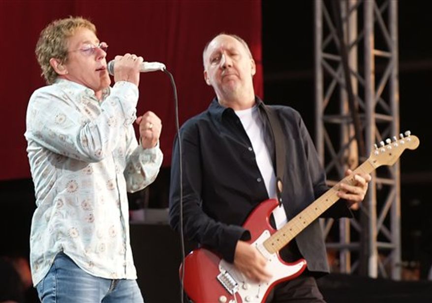 ** FILE ** In this July 2, 2006 photo, Roger Daltrey and Pete Townshend of The Who are shown during their performance at the Hyde Park Music Festival, in London. Daltrey and Townshend are taking "Quadrophenia" and other Who classics on the road for a U.S. tour this fall, but first plan what Daltrey calls a great finale for the Olympic Games in London. (AP Photo/ Max Nash, File)