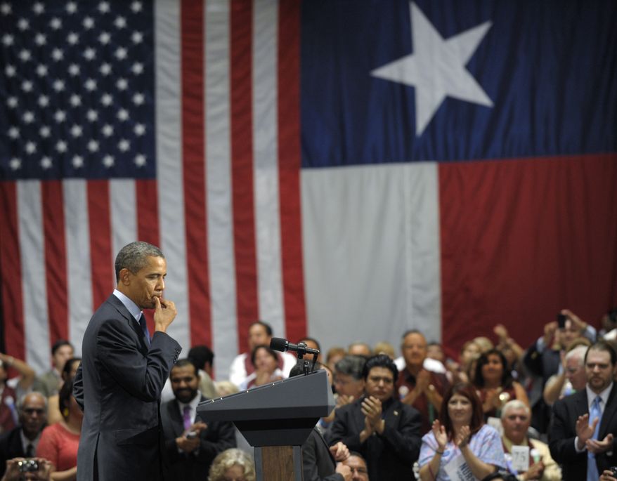 President Obama pauses as the audience applauds during his speech at a fundraising event at the Henry B. Gonzalez Convention Center in San Antonio on Tuesday, July 17, 2012. (AP Photo/Susan Walsh)