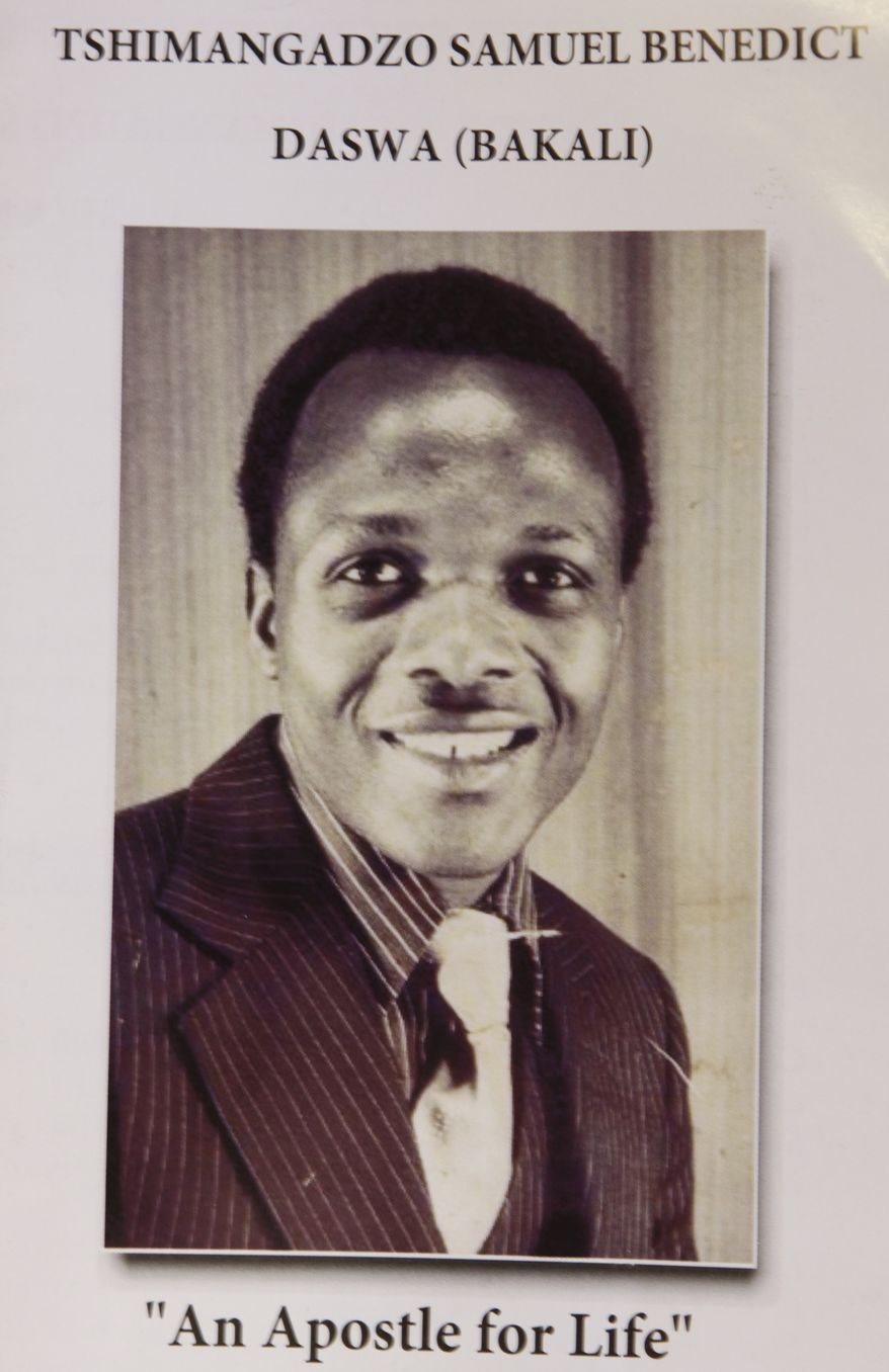 This Friday, June 15, 2012 photo shows a pamphlet in Johannesburg promoting the canonization process of Benedict Daswa. The Catholic schoolteacher, revered for his good deeds, honesty and compassion, was also a fierce foe of the witchcraft widely practiced here. When a lightning bolt struck the village and Daswa resisted the elders' call for hiring an exorcist, he was chased into a pub and beaten to death. Twenty-two years later, his memory is still so revered that he has been nominated as South Africa's first saint. The Vatican is studying the application. Daswa, who was born Tshimangadzo Samuel and raised in a traditionalist South African family, changed his name when he became a Catholic. (AP Photo/Denis Farrell)