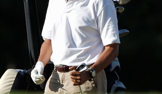 President Obama prepares to tee off while playing golf at Mink Meadows Golf Club on the island of Martha’s Vineyard, Mass., in August 2011. (Associated Press)