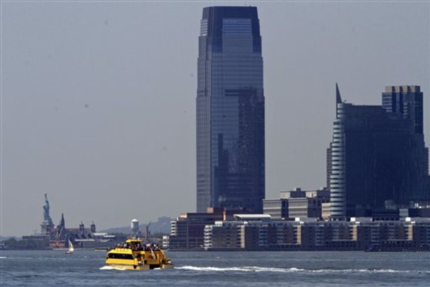 A water taxi is seen from the Hudson River Park in New York. (AP Photo/Mary Altaffer)