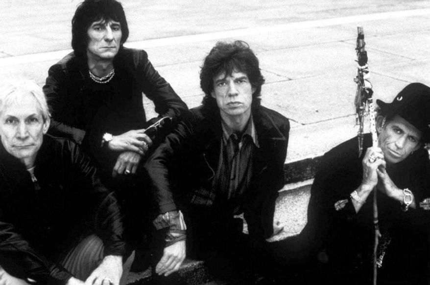 The Rolling Stones' (from left) Charlie Watts, Ron Wood, Mick Jagger and Keith Richards pose for a 1998 group portrait. (Associated Press)