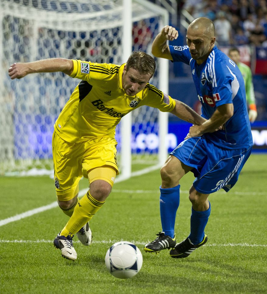 Columbus Crew's Chris Birchall (left) scored the lone goal in the defeat of D.C. United on Saturday night. (AP Photo/The Canadian Press, Paul Chiasson)