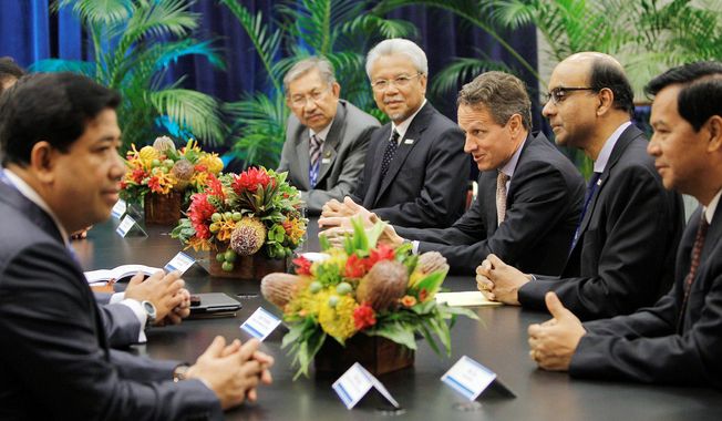 U.S. Treasury Secretary Timothy F. Geithner (third from right) talks with Myanmar Minister of Finance Hla Tun (right) and government officials from Cambodia, Brunei, Malaysia and Singapore during a meeting with Association of Southeast Asian nations finance ministers at the Asia-Pacific Economic Cooperation summit in Honolulu in November 2011. Myanmar appeals to U.S. commercial ventures. (Associated Press)