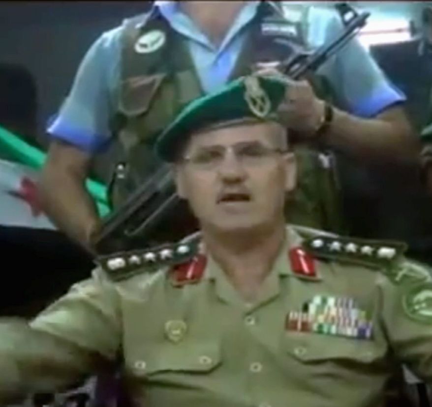 This image made from amateur video released by the Ugarit News purports to show Syrian Brig. Gen. Abdul-Nasser Farzat, from the Aleppo Academy for Military Engineering, claiming to have defected. (Ugarit News via Associated Press)