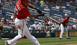 Washington Nationals shortstop Ian Desmond had three hits in the team&#39;s 8-0 loss to the St. Louis Cardinals on Wednesday in Game 3 of the National League Division Series. (Associated Press)