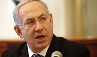 Israeli Prime Minister Benjamin Netanyahu opens the weekly Cabinet meeting at his office in Jerusalem on Sunday, July 22, 2012. (AP Photo/Gali Tbbon, Pool)

