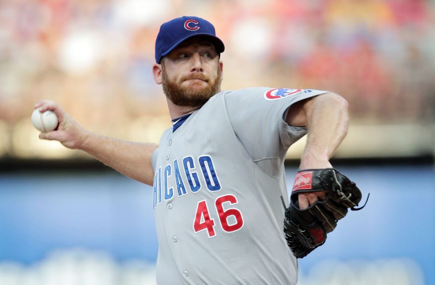 Trade talks indicate Ryan Dempster will be shipped from Chicago to Atlanta, but with 10 years in the majors and five with the Cubs, he has the right to veto the deal. (Associated Press)