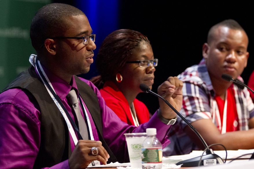 **FILE** Lawrence Stallworth II (left), 20, of Cleveland, who was diagnosed with HIV at 17, speaks July 22, 2012, on a youth panel at the International AIDS Conference in Washington. Sitting next to Stallworth is Helena Nangombe, of Namibia, and Romane Knight, of Jamaica. (Associated Press)