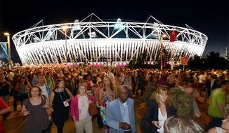 Crowds leave the Olympic Stadium at the Olympic Park in London on July 23, 2012, following the dress rehearsal for the opening ceremony for the 2012 Olympic Games. (Associated Press)