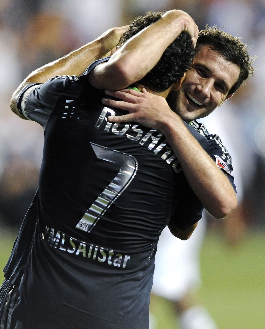 D.C. United All-Stars Chris Pontius (right) and Dwayne De Rosario celebrate after scoring against Chelsea in the MLS All-Star game in Chester, Pa., on Wednesday night. Pontius was named MVP in the MLS All-Stars' 3-2 win. (AP Photo/Michael Perez)