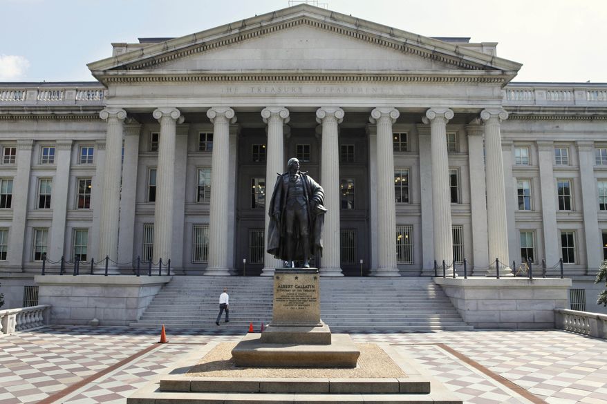 **FILE** A statue of former Treasury Secretary Albert Gallatin stands outside the Treasury Building in Washington on Aug. 8, 2011. (Associated Press)