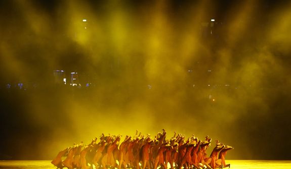 Performers dance during the Opening Ceremony at the 2012 Summer Olympics, Friday, July 27, 2012, in London. (AP Photo/Jae C. Hong)