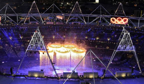 The Olympic rings are suspended over the stadium during the Opening Ceremony at the 2012 Summer Olympics, Friday, July 27, 2012, in London. (AP Photo/Mark J. Terrill)