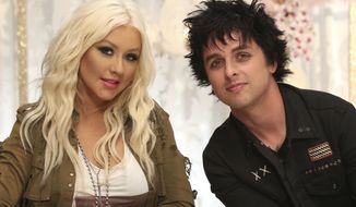 **FILE** Billie Joe Armstrong (right) sits July 25, 2012, with Christina Aguilera. Armstrong will join Aguilera as her team&#39;s mentor this season on NBC&#39;s &quot;The Voice.&quot; (Associated Press/NBCUniversal)