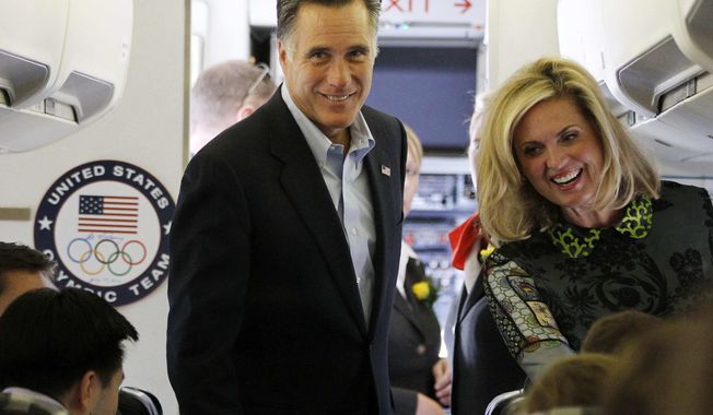 Republican presidential candidate Mitt Romney and his wife, Ann, board a charter plane at London Stansted Airport on Saturday, July 28, 2012, as they travel to Israel. (AP Photo/Charles Dharapak)