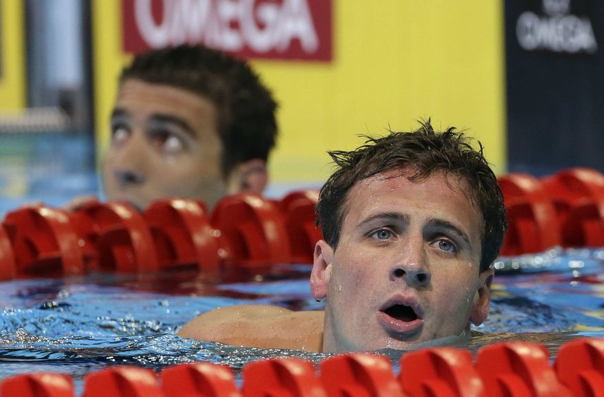 ** FILE ** Ryan Lochte leaves his lane after swimming in a men's 200-meter individual medley semifinal at the U.S. Olympic swimming trials on Friday, June 29, 2012, in Omaha, Neb. At left is Michael Phelps. (AP Photo/Mark Humphrey)