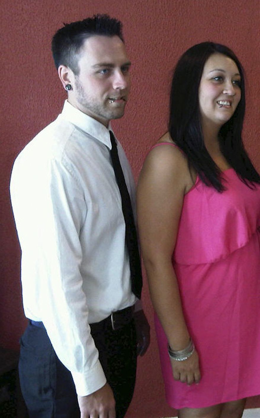 This undated photo provided by the family shows Matt McQuinn (left) and Samantha Yowler. McQuinn was killed and Yowler was wounded in the movie theater shootings July 20, 2012, in Aurora, Colo. (Associated Press)