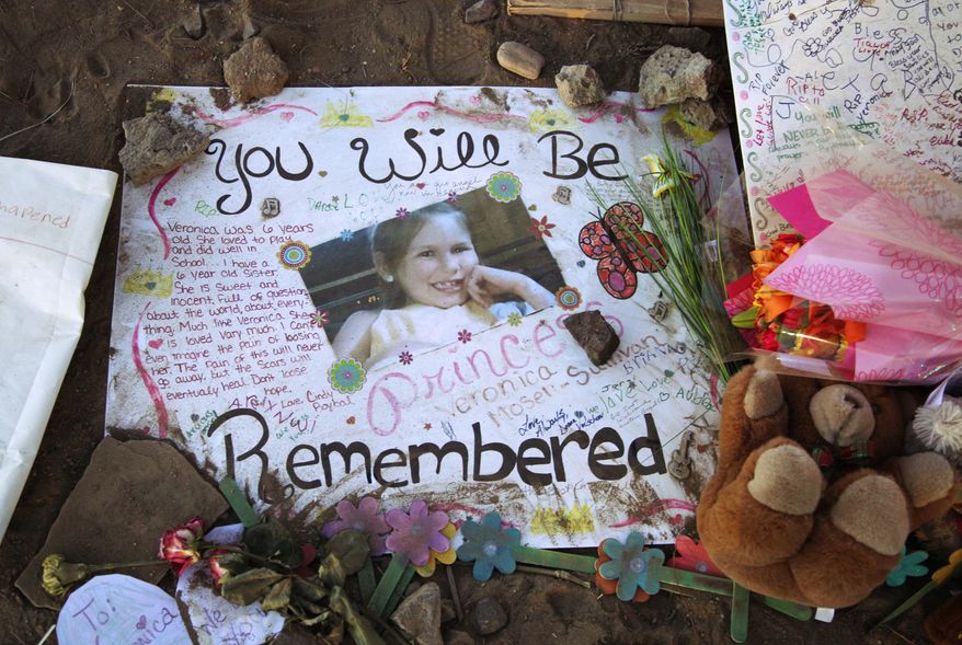 A poster in memory of Veronica Moser-Sullivan, 6, is shown July 27, 2012, at the memorial to victims of the Aurora, Colo., movie theater shooting. (Associated Press)